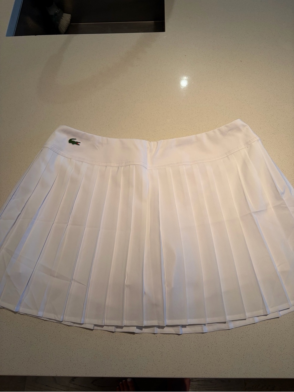 Lacoste White Pleated Mini Skirt with Green Crocodile Logo